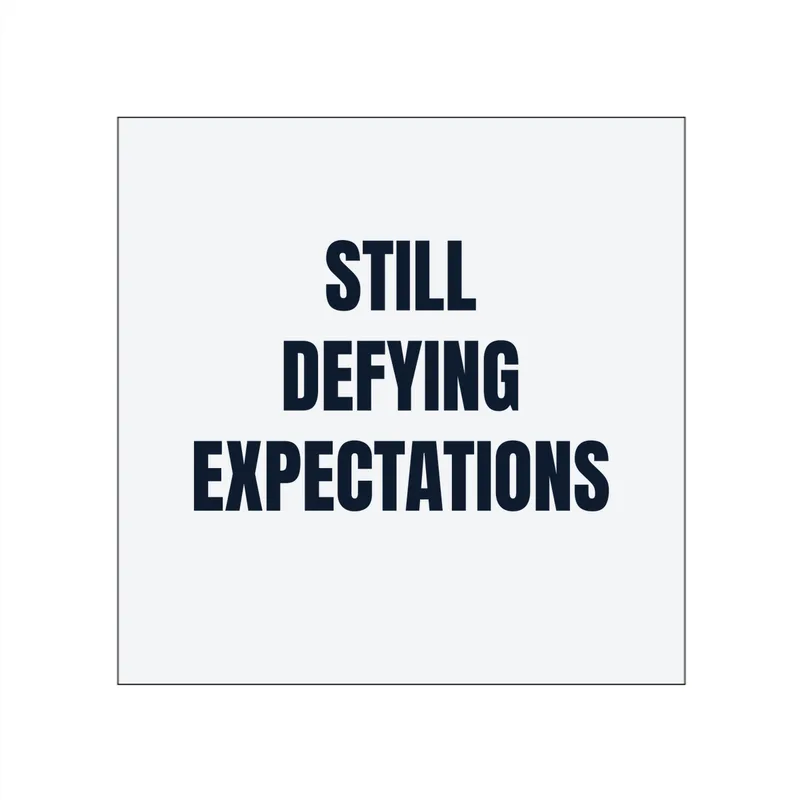 STILL · DEFYING · EXPECTATIONS in White